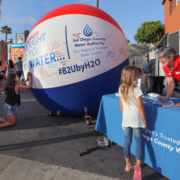 Sunset Market in Oceanside welcomed the "Brought To You By Water" giant beach ball ambassador, accompanied by Water Authority community outreach staff who provided information and answered questions about the region's water supply. Photo: Authority