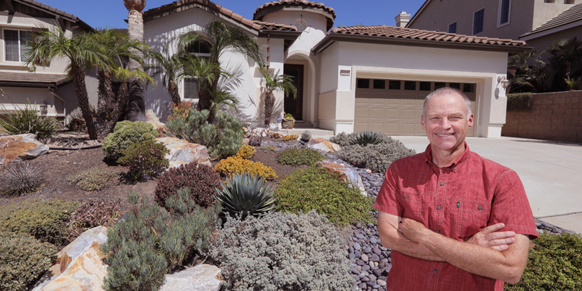 Jeff Moore stands in his front yard featuring his award-winning waterwise landscaping work. Photo: Charlie Neuman, Water Authority Vallecitos