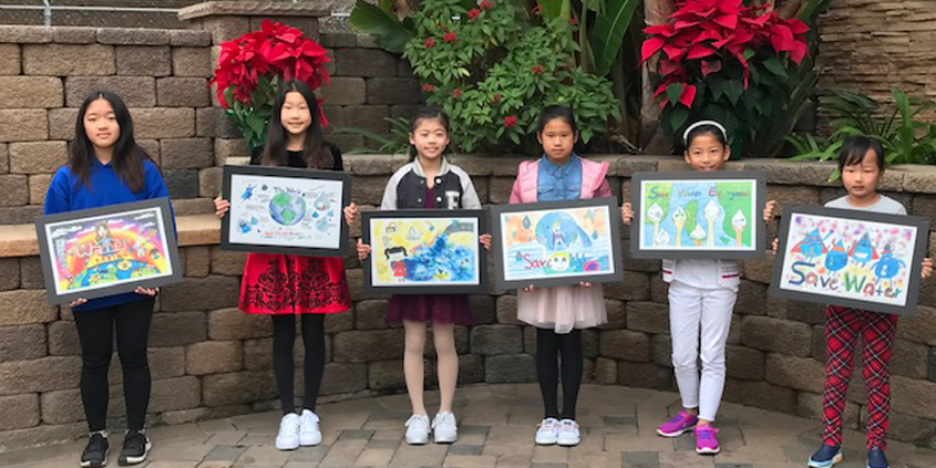 (L to R) 2019 poster contest winners Madelieine Inawen, Claire Zhang, Kate hu, Alanis Huang, and Weiyi Xu with their winning artwork. Photo: Courtesy City of San Diego