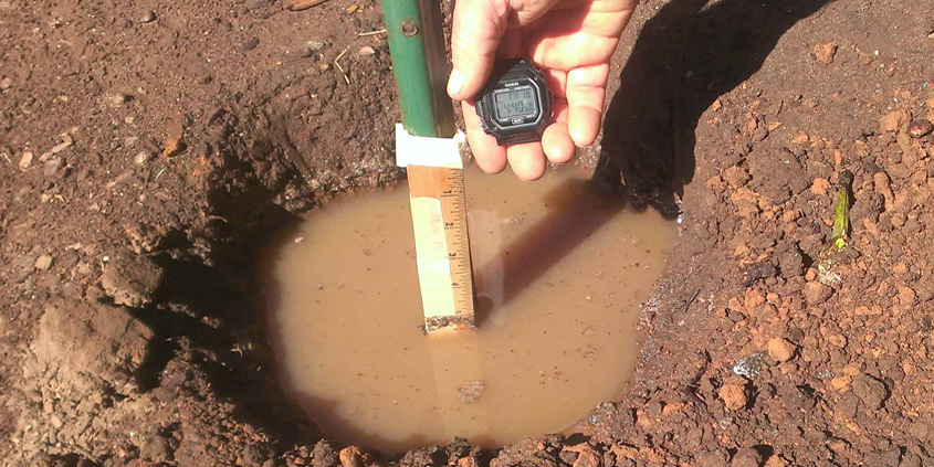 A simple, quick test will tel you how well your soil drains. Photo: Greywater.org landscape soil