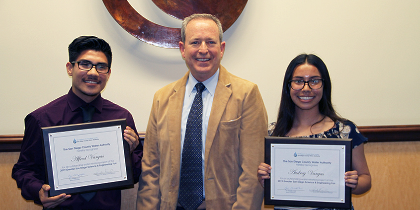 Alfred and Audrey Vargas with Water Authority Board Chair Jim Madaffer after they were awarded first place in the Greater San Diego Science and Engineering Fair for designing a device that could treat wastewater and generate electricity. Photo: Water Authority