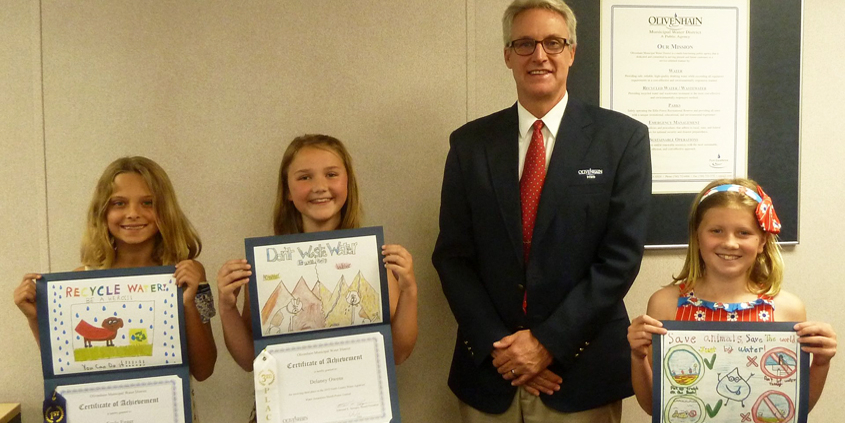 OMWD Board President Ed Sprague with 2019 poster contest winners (L to R) Sayla Egger, Addison Bowe, and Delaney Owens. Photo: OMWD Water Awareness