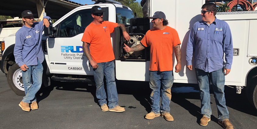L to R: Colter Shannon, Toby Stoneburner, Matt Perez, and Austin Wendt, stand in front of the utility vehicle they will take to Paradise, Calif. to help with water repairs from November’s treacherous Camp Fire. Photo: FPUD