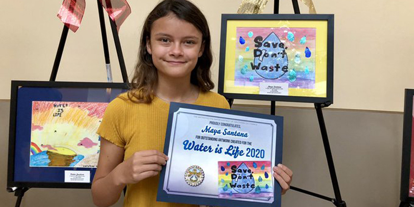 Calendar poster contest winner Maya Santana, a fifth grader from Wolf Canyon Elementary School in the Otay Water District, displays her winning artwork. Photo: Otay Water District Water Is Life Calendar