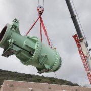 Crane lifts valve from roof