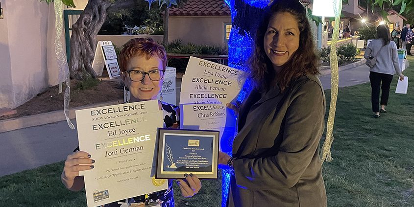 Gayle Falkenthal (L) and Lisa Urabe display the San Diego County Water Authority and Vallecitos Water District's multiple San DIego Press Club Journalism Awards. Photo: San Diego County Water Authority Press Club Awards